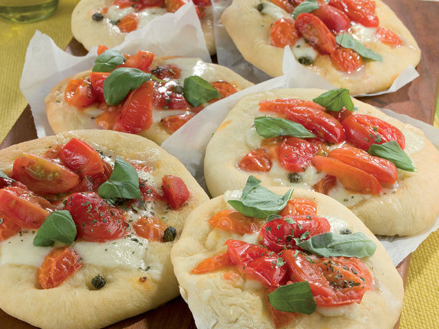 First dishes: Pizzette with tomato,  oil and basil