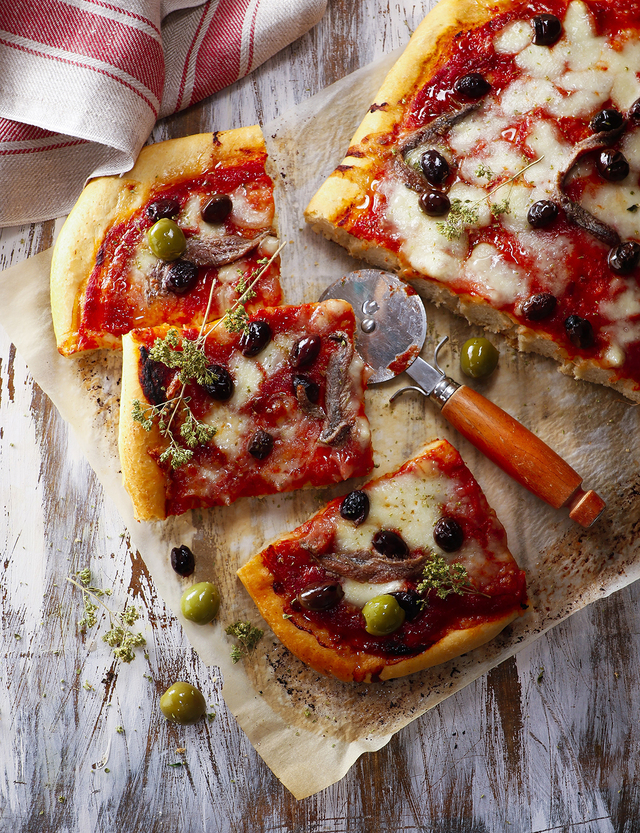 Anchovy, olive and oregano pizza